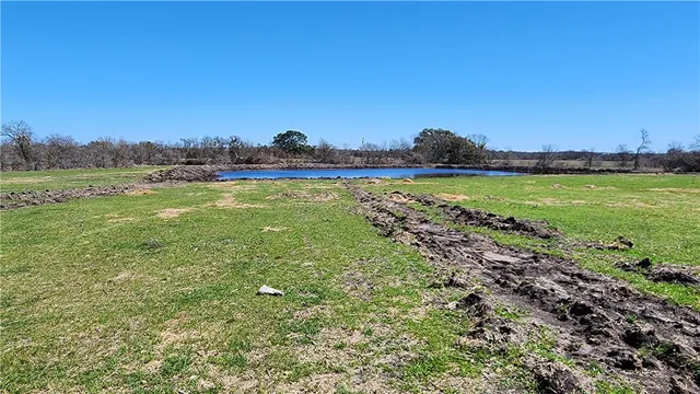 a view of a lake in front of a house
