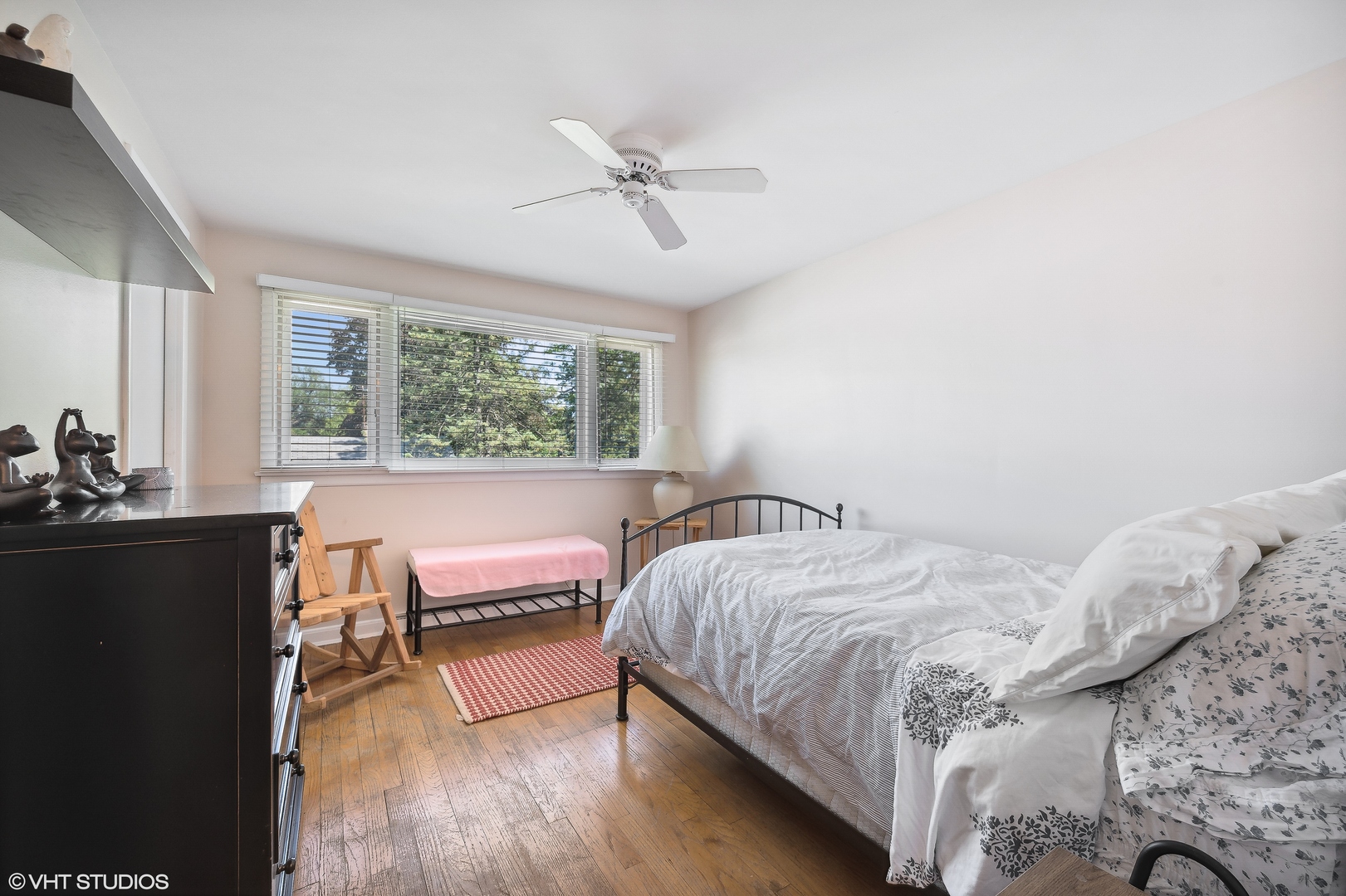 1544 Longvalley Road Glenview, IL 60025 - Photo 13 of 25 a bedroom with a bed and a dresser next to a window