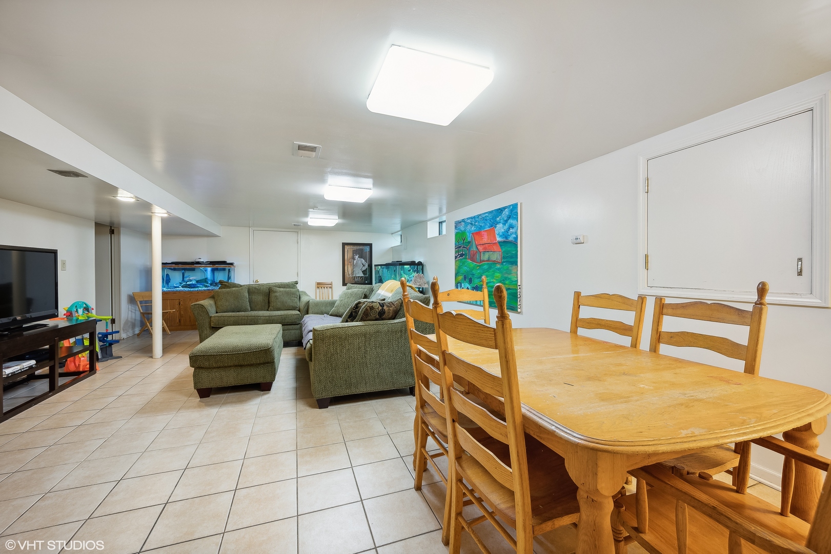 1544 Longvalley Road Glenview, IL 60025 - Photo 16 of 25 a living room with furniture a flat screen tv and a table