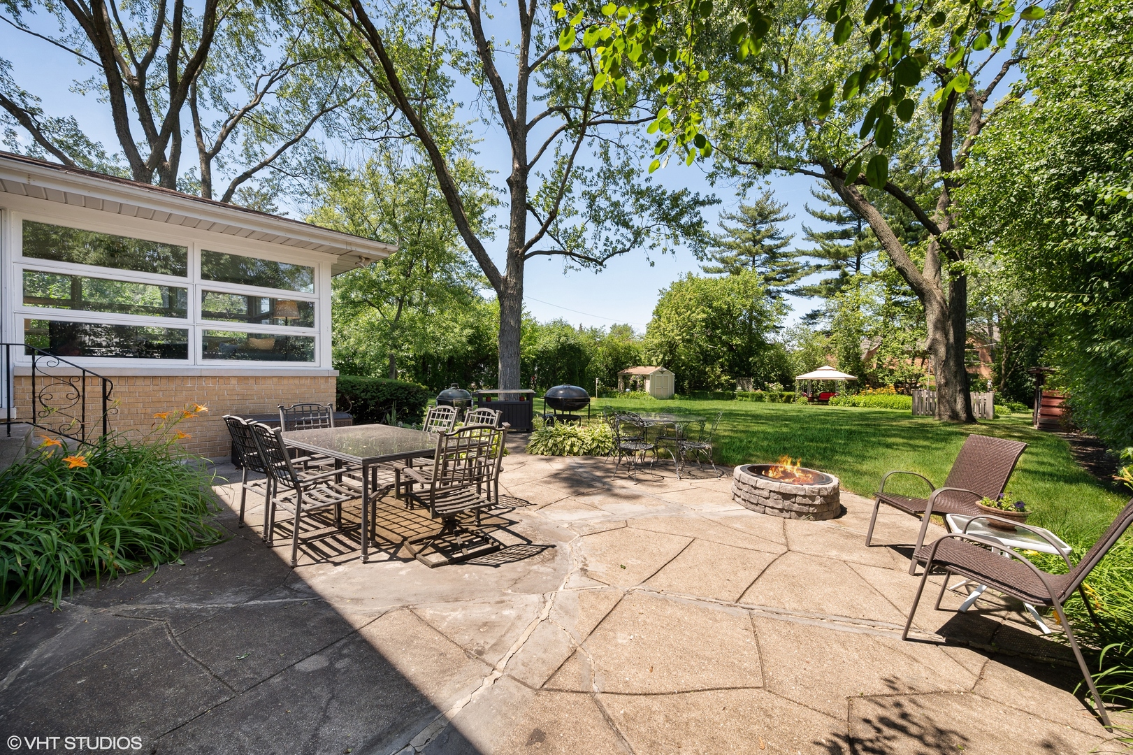 1544 Longvalley Road Glenview, IL 60025 - Photo 19 of 25 a view of backyard with seating space and trees