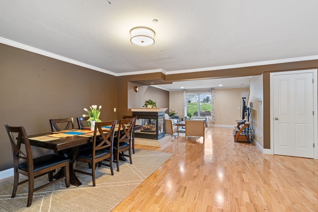 216 Rangeway Road, Unit 182 Billerica, MA 01862 - Photo 11 of 42 a view of a dining room with furniture and wooden floor