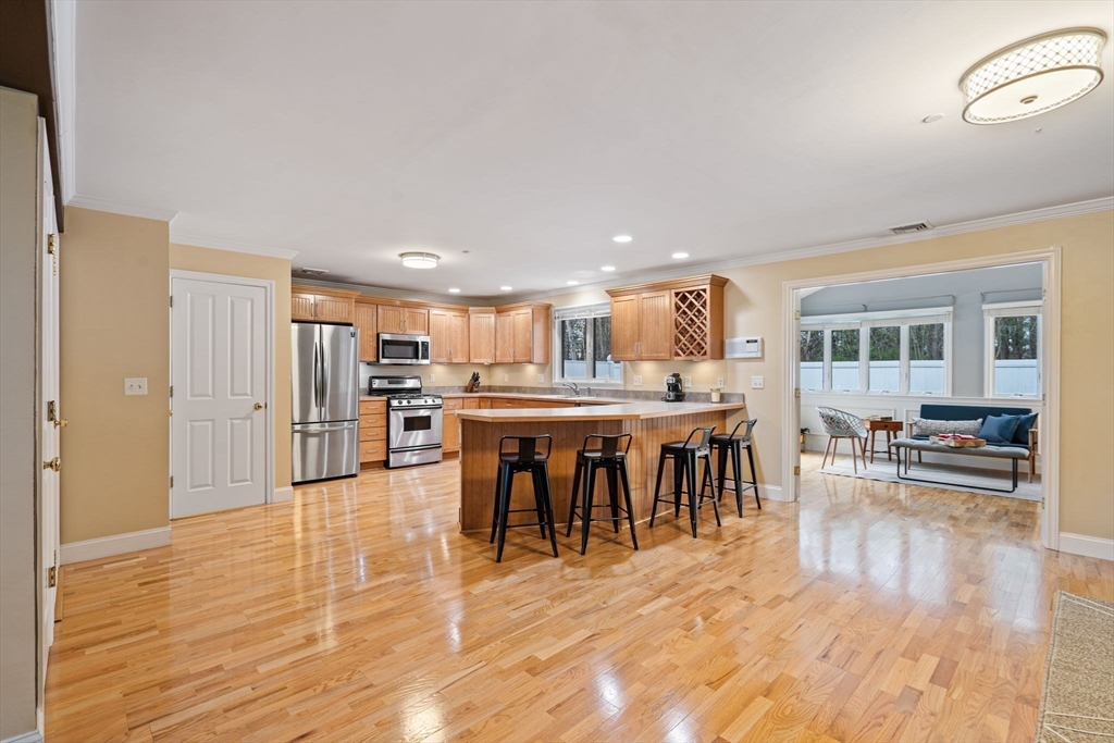 216 Rangeway Road, Unit 182 Billerica, MA 01862 - Photo 16 of 42 a living room with stainless steel appliances furniture and wooden floor