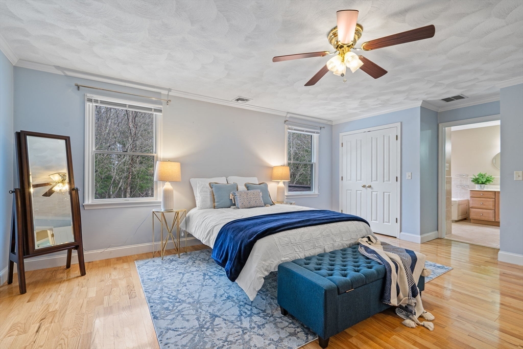 216 Rangeway Road, Unit 182 Billerica, MA 01862 - Photo 23 of 42 a bedroom with a bed and a chandelier