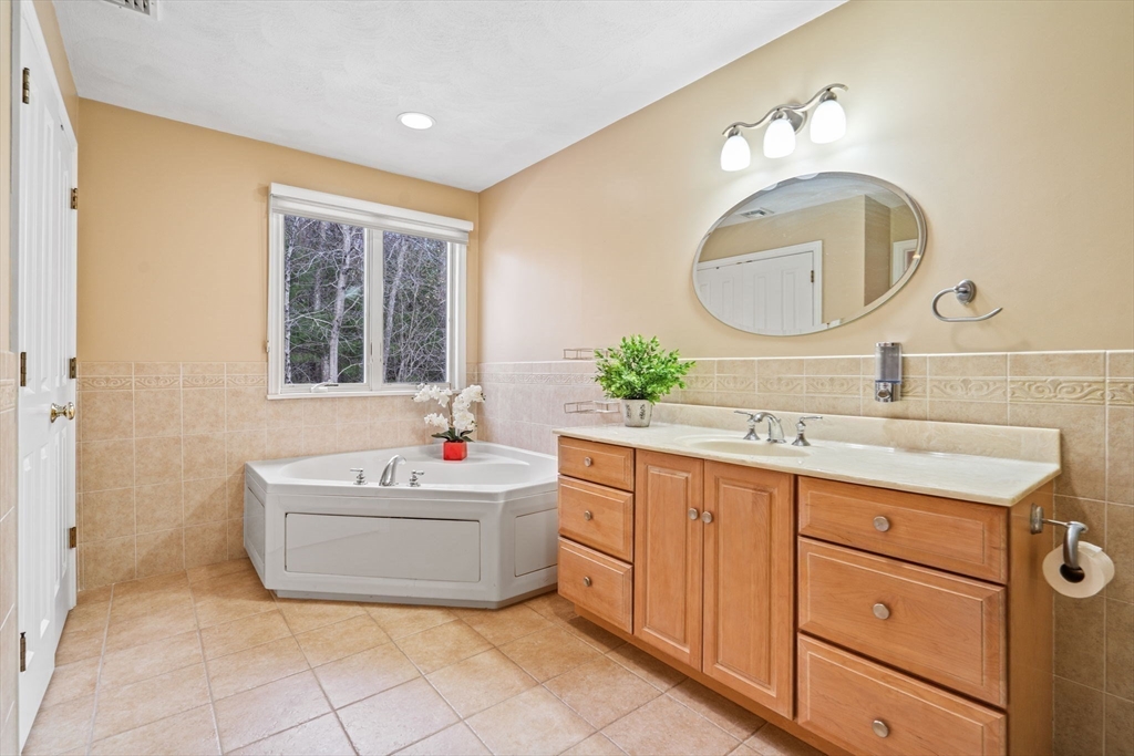 216 Rangeway Road, Unit 182 Billerica, MA 01862 - Photo 26 of 42 a bathroom with a sink and a mirror