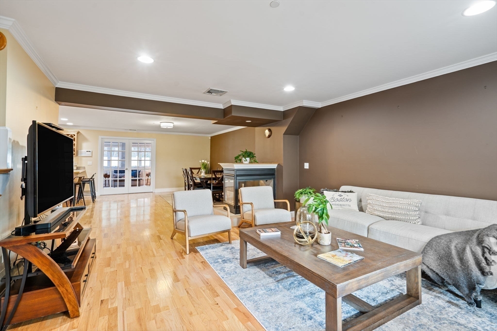216 Rangeway Road, Unit 182 Billerica, MA 01862 - Photo 9 of 42 a living room with furniture and a flat screen tv
