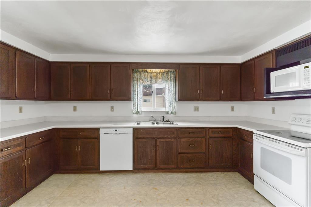 2116 Claridge Elliott Road Claridge, PA 15623 - Photo 11 of 25 a kitchen with a sink and cabinets