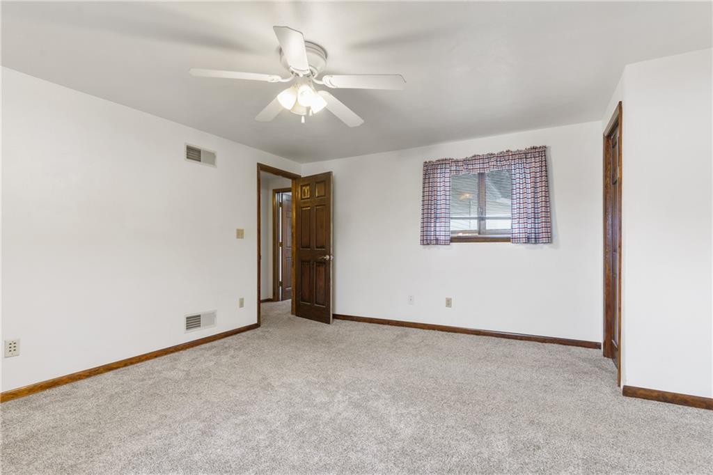 2116 Claridge Elliott Road Claridge, PA 15623 - Photo 18 of 25 an empty room with chandelier fan