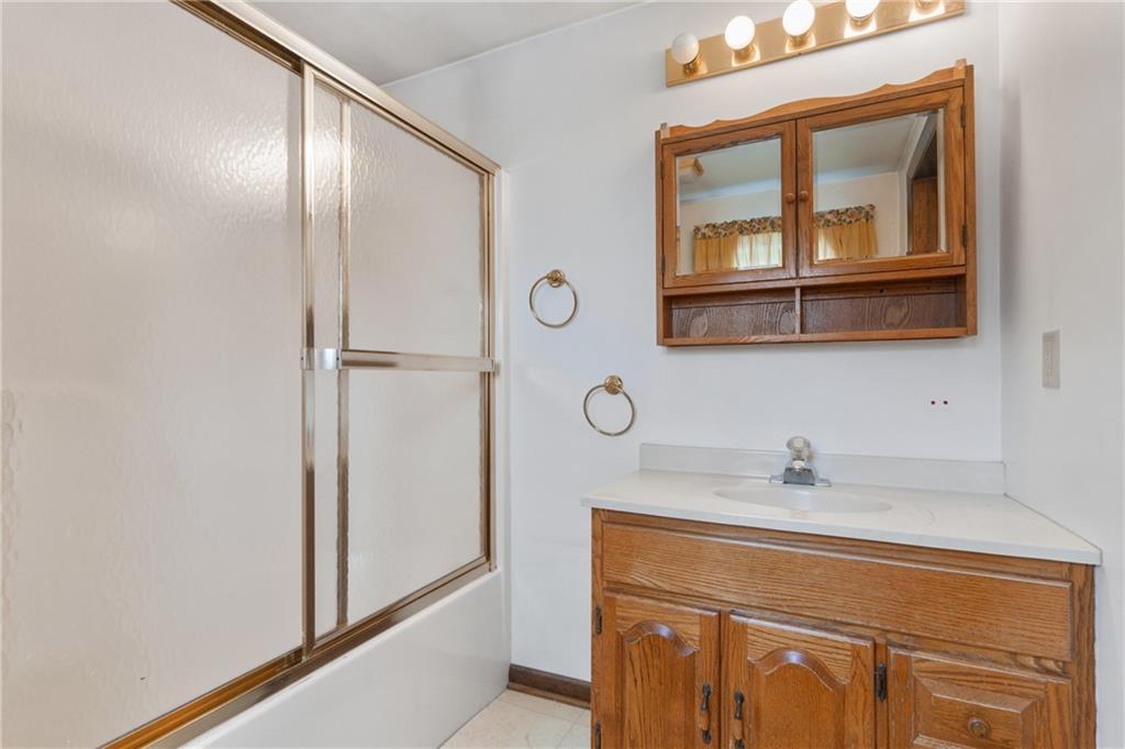 2116 Claridge Elliott Road Claridge, PA 15623 - Photo 22 of 25 a bathroom with a sink and a mirror