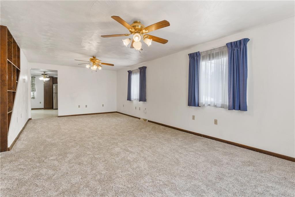 2116 Claridge Elliott Road Claridge, PA 15623 - Photo 7 of 25 an empty room with ceiling fan and window