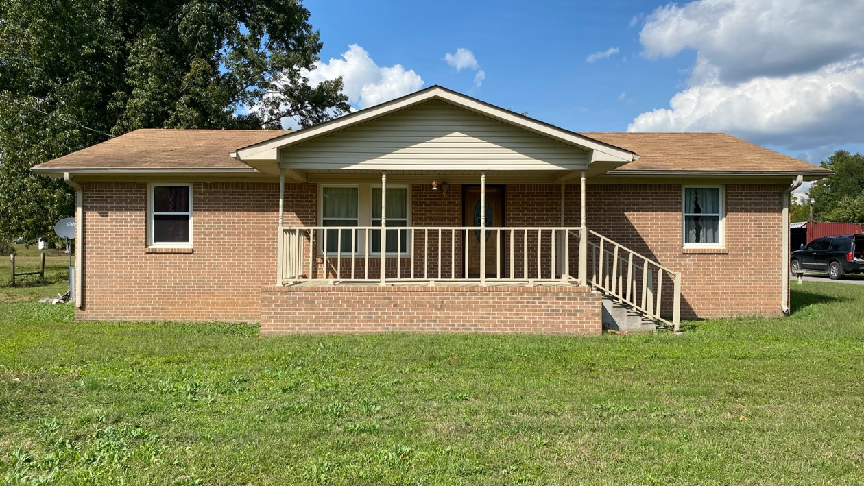 27085 Bethel Road Elkmont, AL 35620 - Photo 2 of 45 a front view of a house with yard and deck