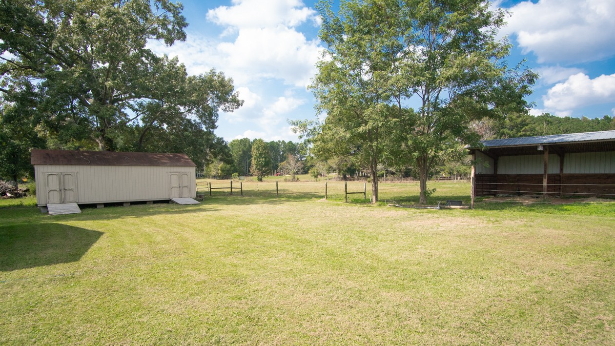 27085 Bethel Road Elkmont, AL 35620 - Photo 18 of 45 a swimming pool with outdoor seating and yard