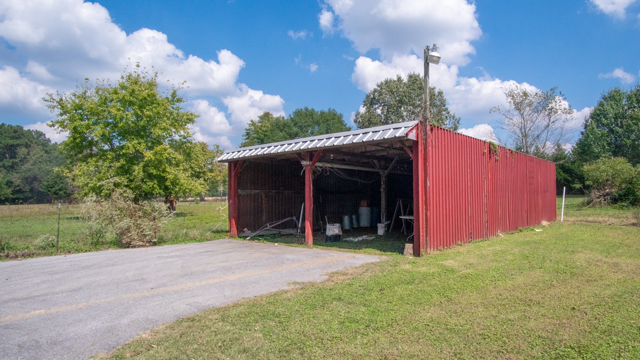 27085 Bethel Road Elkmont, AL 35620 - Photo 23 of 45 a view of an house with backyard and garage