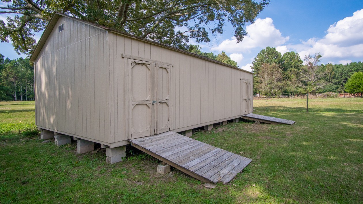 27085 Bethel Road Elkmont, AL 35620 - Photo 26 of 45 a view of a backyard with sitting area