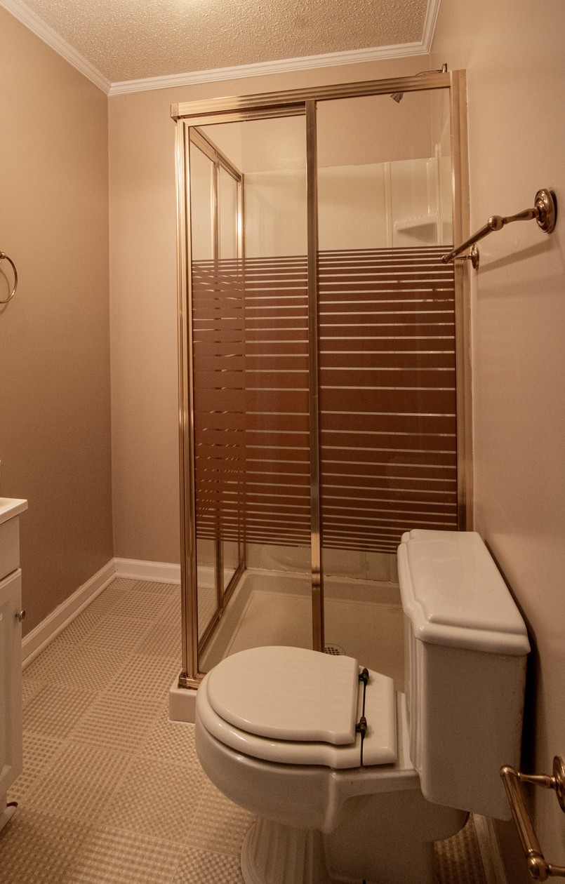 27085 Bethel Road Elkmont, AL 35620 - Photo 40 of 45 a bathroom with a toilet and a shower