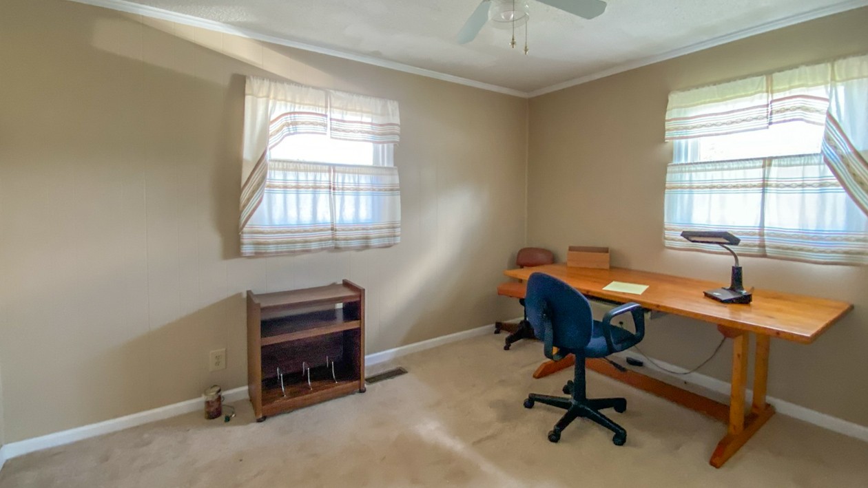 27085 Bethel Road Elkmont, AL 35620 - Photo 41 of 45 a view of a workspace with a window and couch