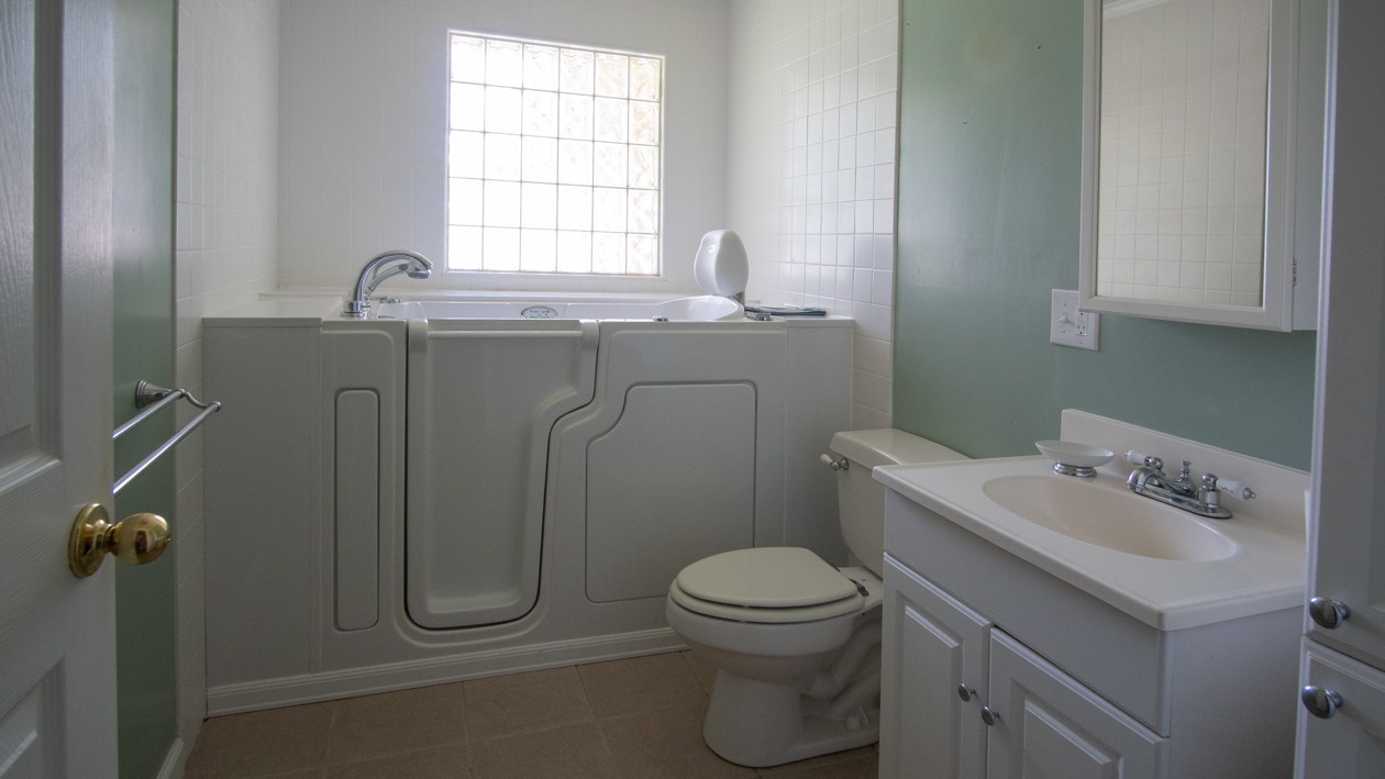 27085 Bethel Road Elkmont, AL 35620 - Photo 42 of 45 a bathroom with a sink a toilet and a window