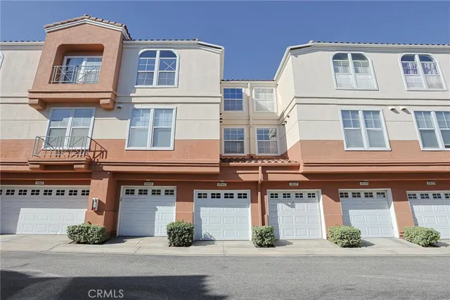a view of a palm trees front of a building