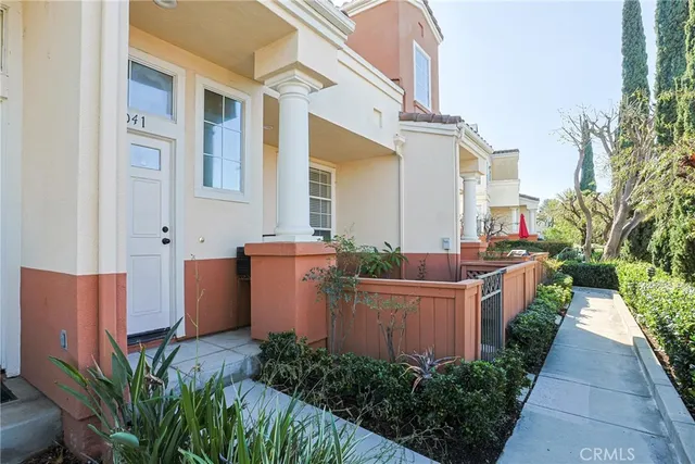 a view of a house with brick walls