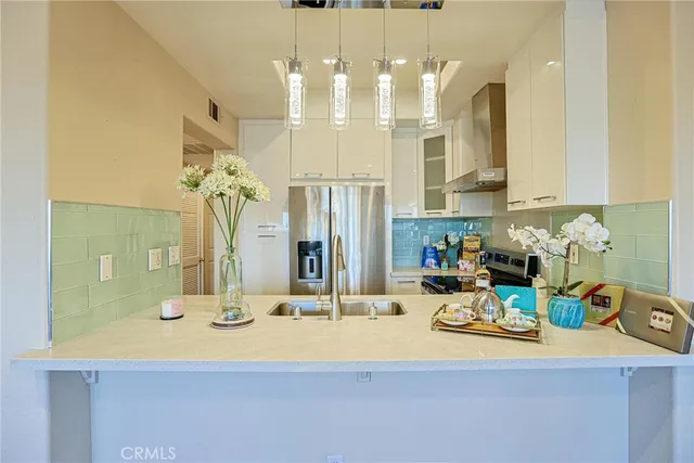 a bathroom with a sink double vanity granite and a mirror
