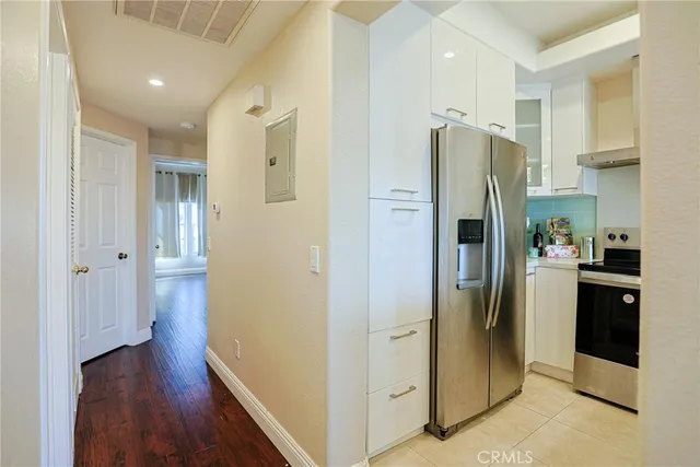 a kitchen with stainless steel appliances a sink and cabinets