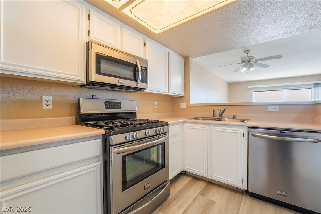 8070 West Russell Road, Unit 2024 Las Vegas, NV 89113 - Photo 9 of 19 A streamlined kitchen presents stainless steel appliances and ample cabinetry.