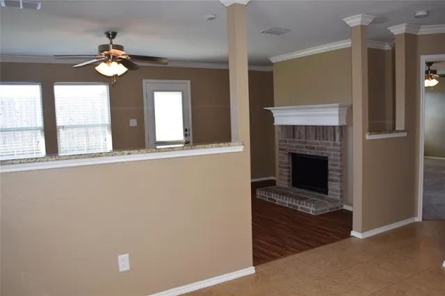 a view of livingroom with fireplace and window