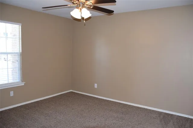 an empty room with closet area