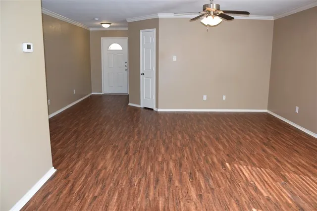 wooden floor in an empty room with a mirror