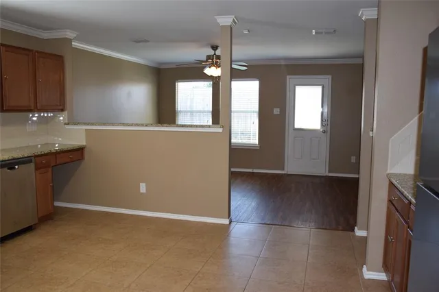 a view of a kitchen with a sink and dishwasher kitchen appliances