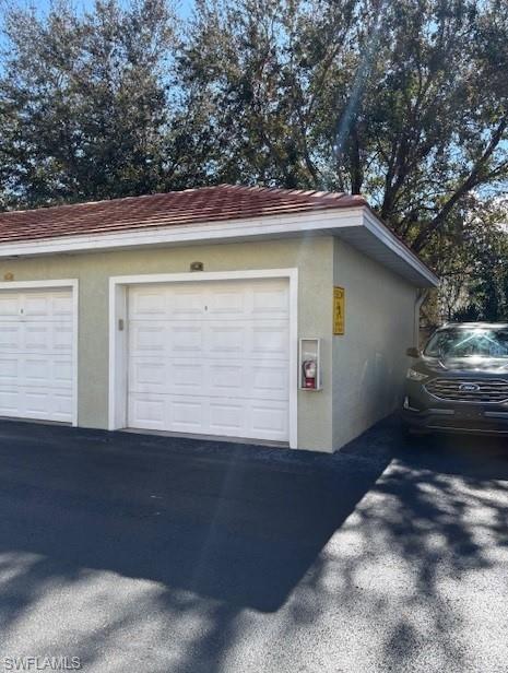 4520 Botanical Pl Circle, Unit 403 Naples, FL 34112 - Photo 2 of 2 View of garage