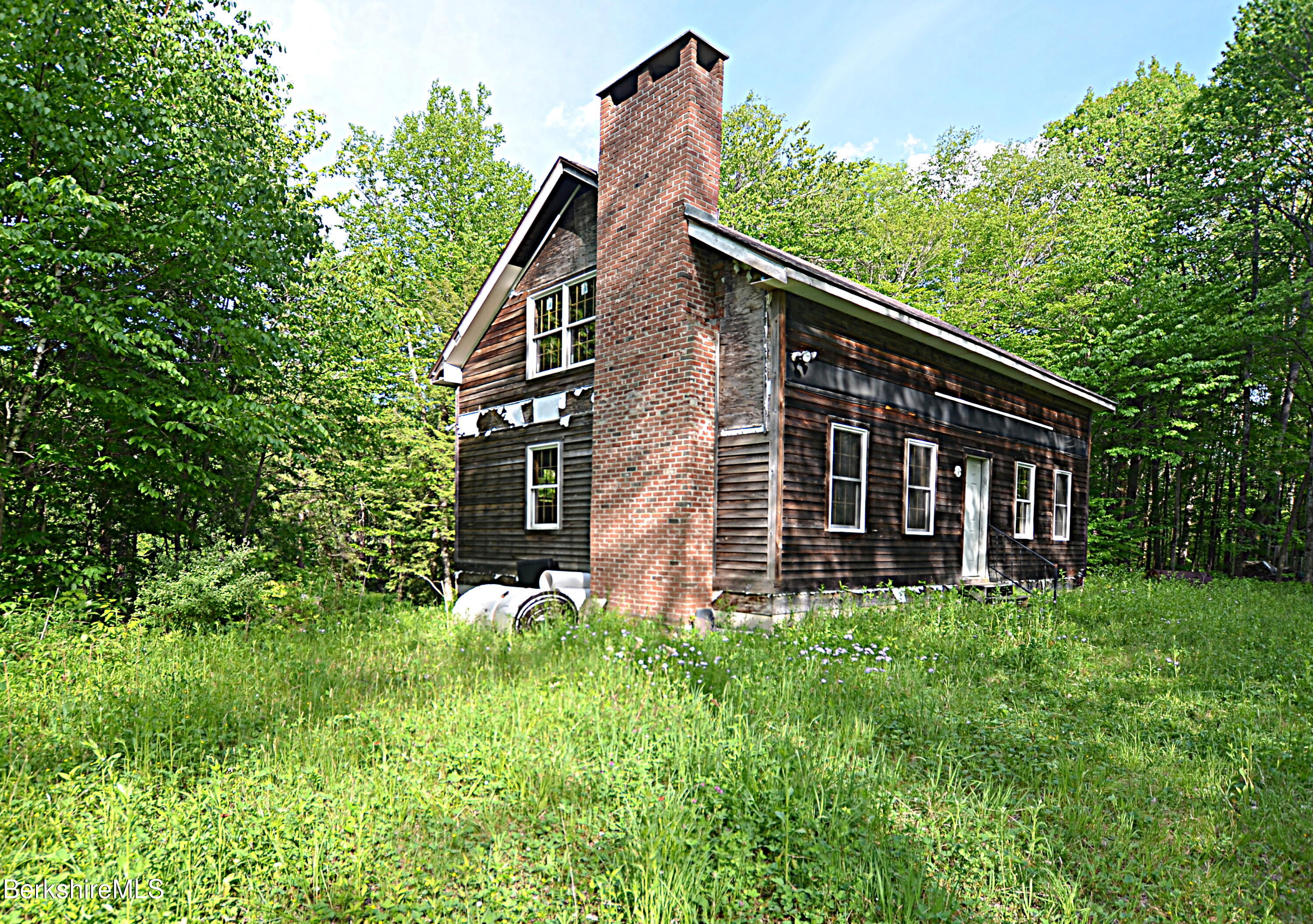 80 Town Hill Road Middlefield, MA 01011 - Photo 2 of 44 a backyard of a house with lots of green space
