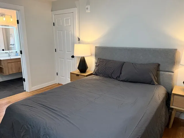 a bedroom with a bed and a view of bedroom