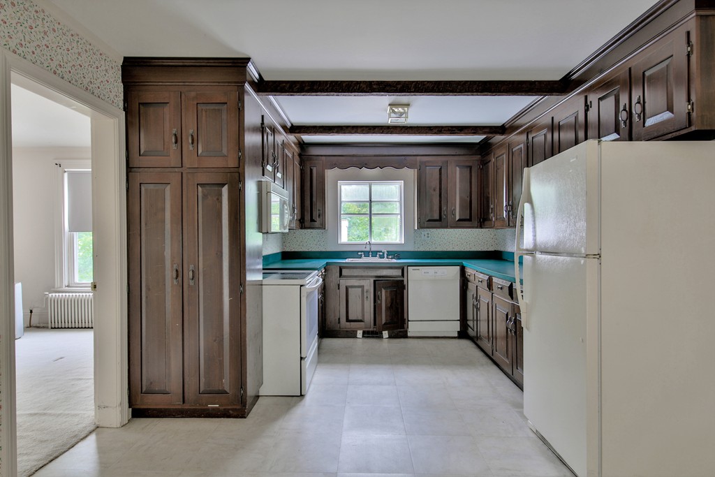 21 Bennett Street Manchester, MA 01944 - Photo 14 of 17 a view of kitchen with refrigerator and cabinets