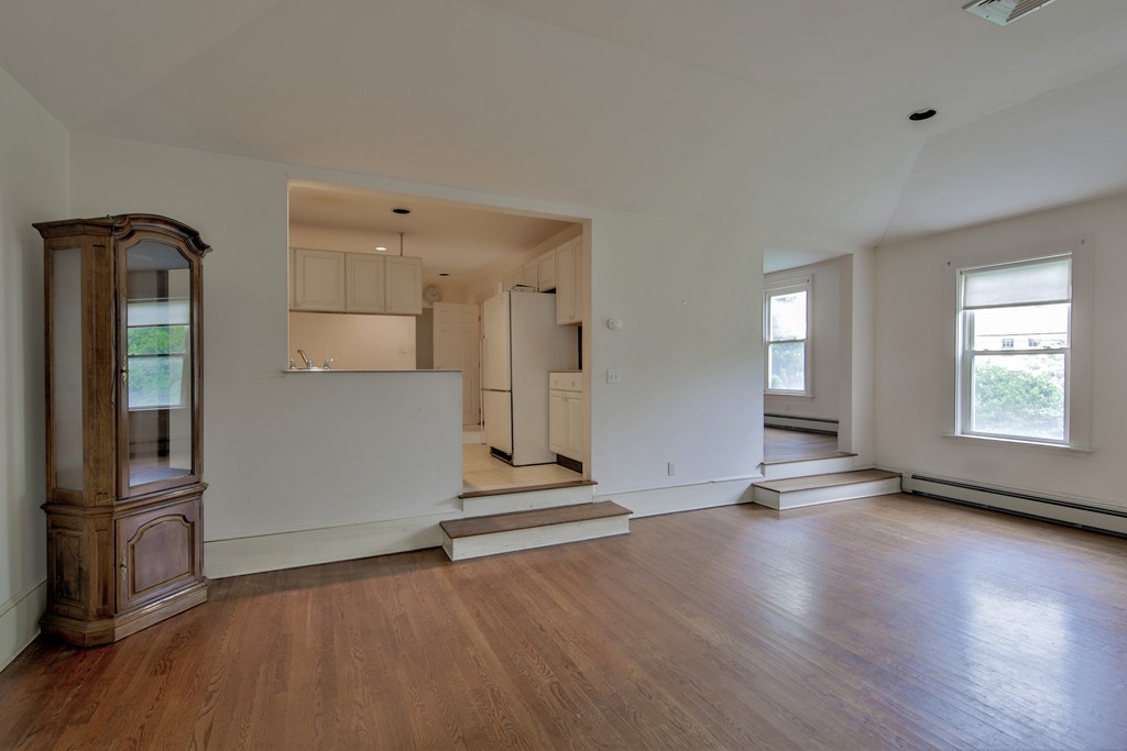 21 Bennett Street Manchester, MA 01944 - Photo 10 of 17 an empty room with wooden floor and windows