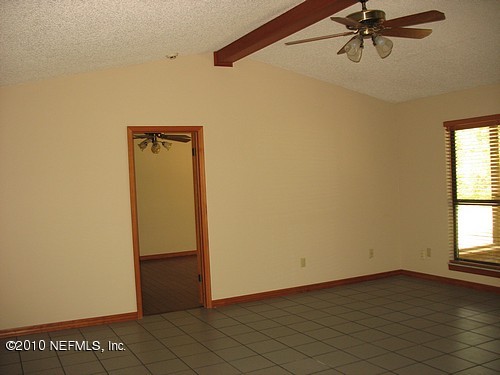 75122 Edwards Road Yulee, FL 32097 - Photo 5 of 8 a view of an empty room with a window