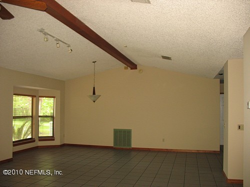 75122 Edwards Road Yulee, FL 32097 - Photo 6 of 8 an empty room with windows