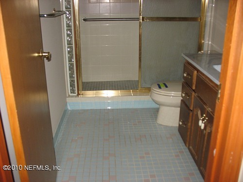 75122 Edwards Road Yulee, FL 32097 - Photo 7 of 8 a bathroom with a toilet and a shower