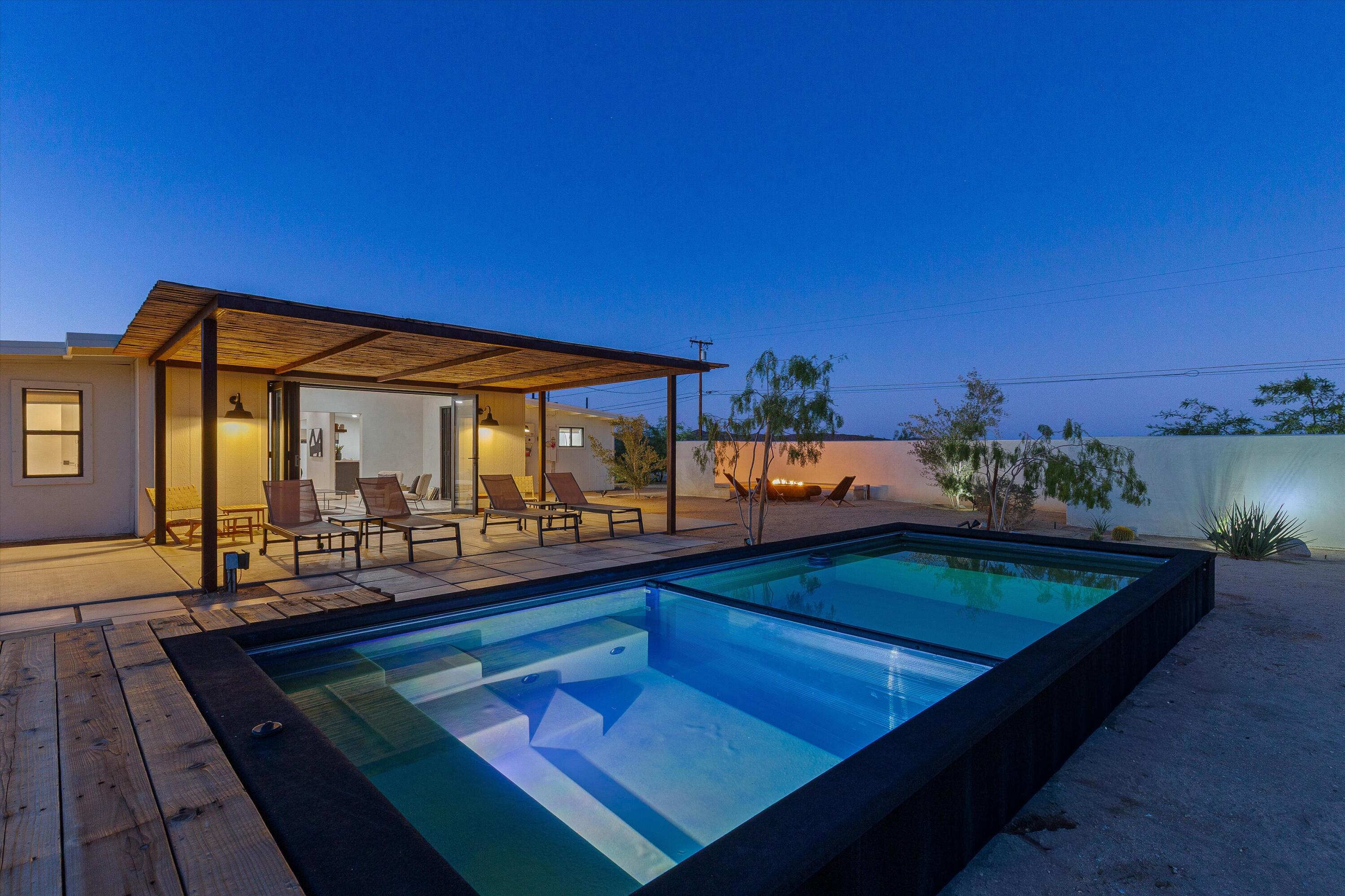 a view of swimming pool with seating area