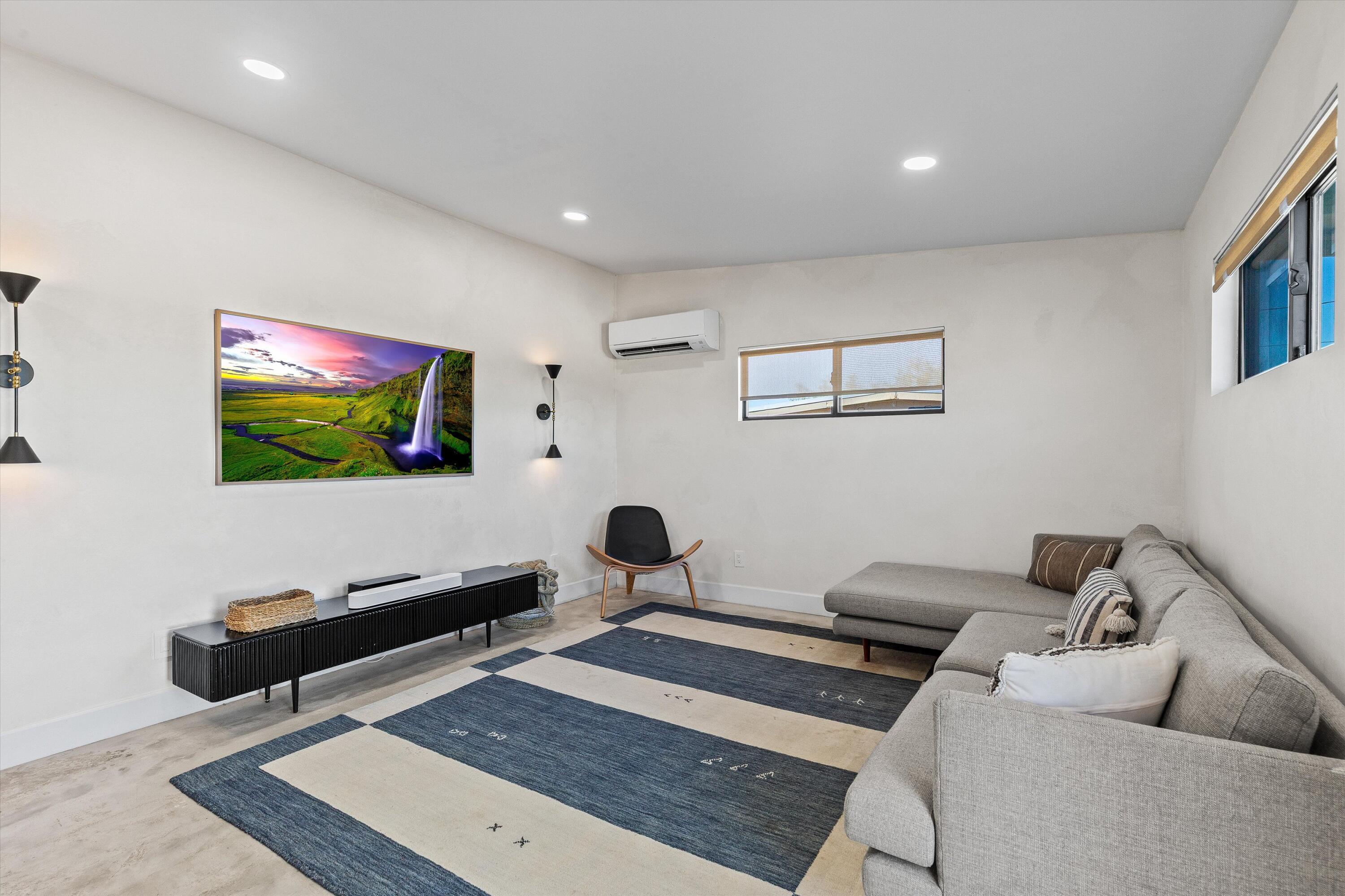4610 Sunkist Road Joshua Tree, CA 92252 - Photo 13 of 55 a living room with furniture and a flat screen tv