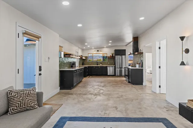 a sink with a granite top and potted plant