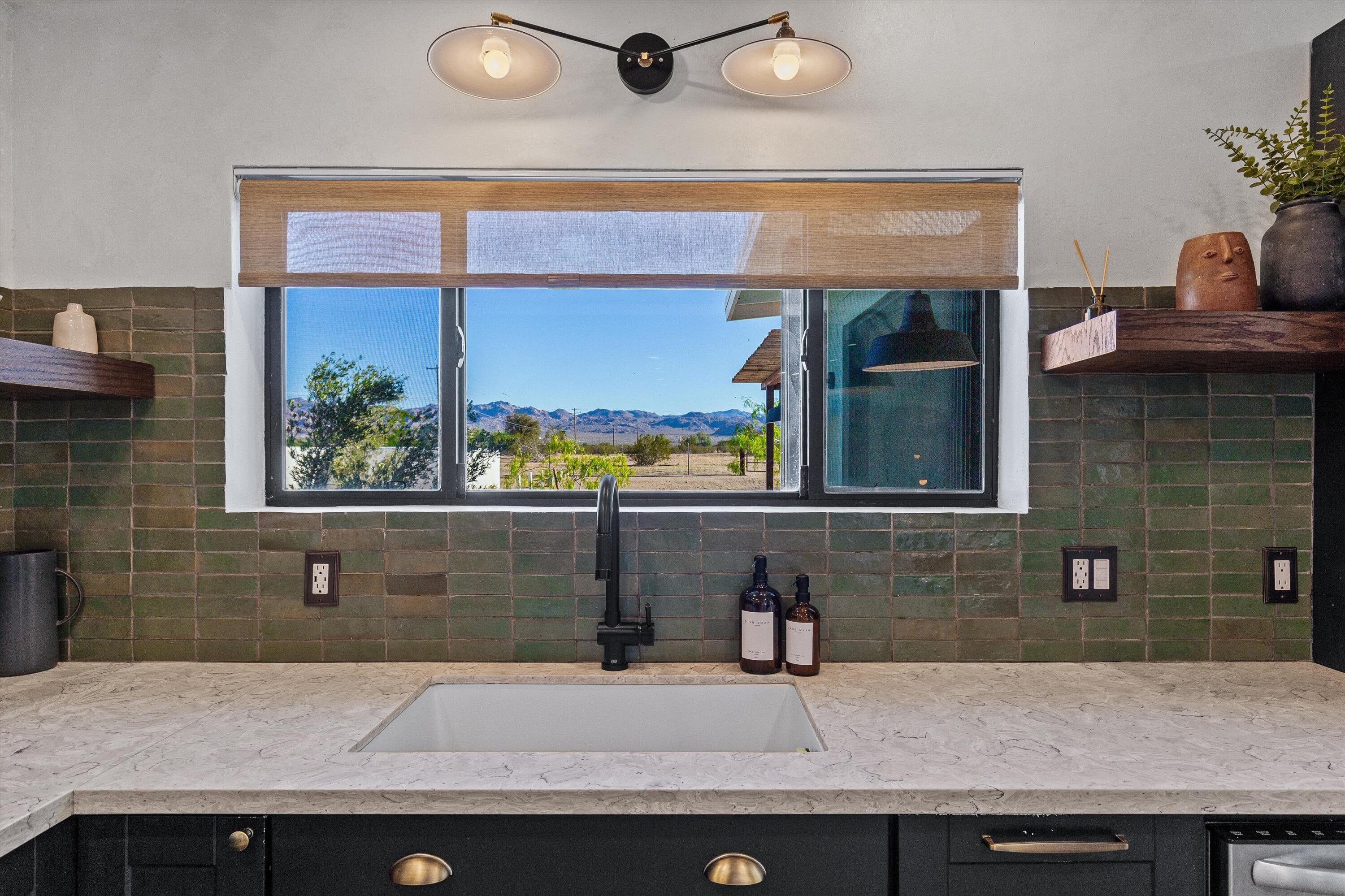 4610 Sunkist Road Joshua Tree, CA 92252 - Photo 18 of 55 a sink with a granite top and potted plant