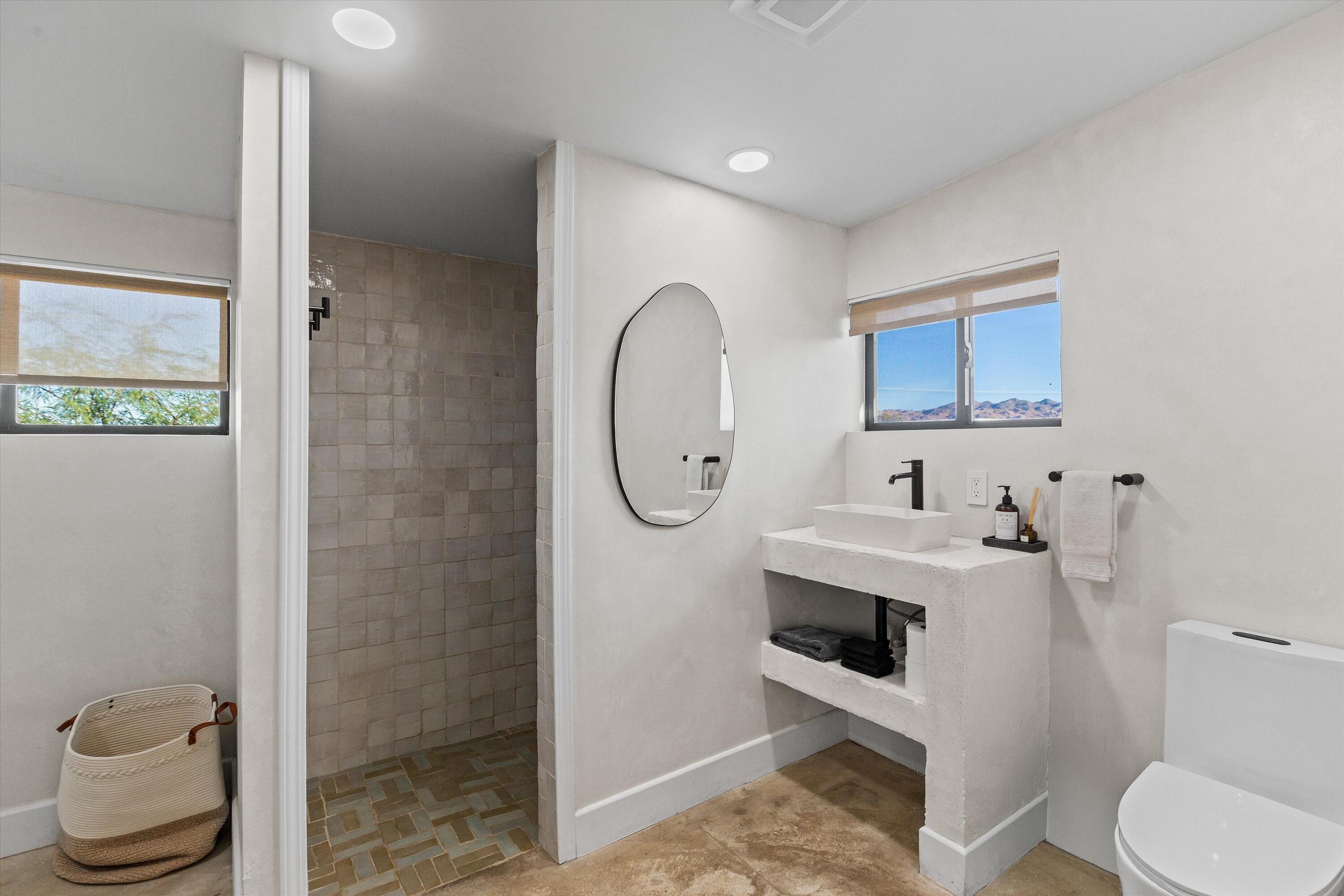 4610 Sunkist Road Joshua Tree, CA 92252 - Photo 20 of 55 a bathroom with a toilet sink and shower