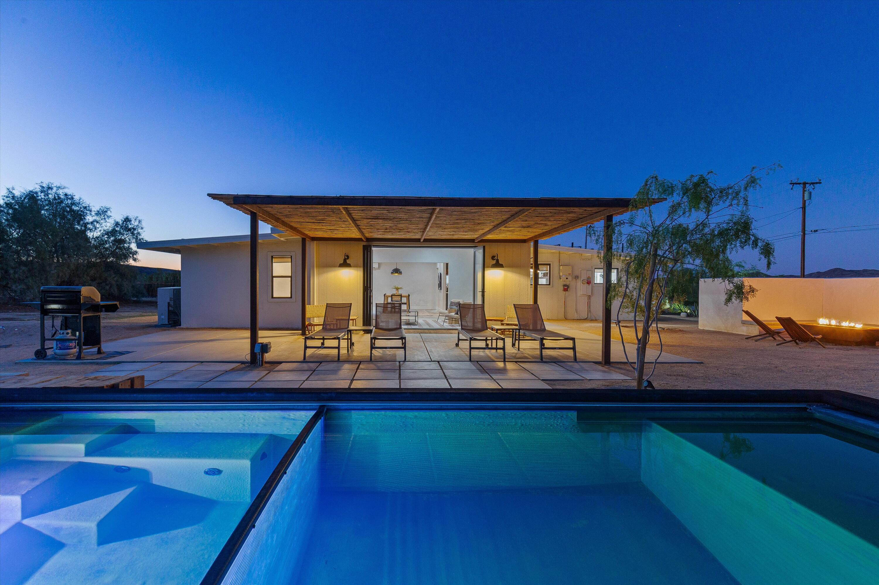 4610 Sunkist Road Joshua Tree, CA 92252 - Photo 3 of 55 a view of a swimming pool with an outdoor seating