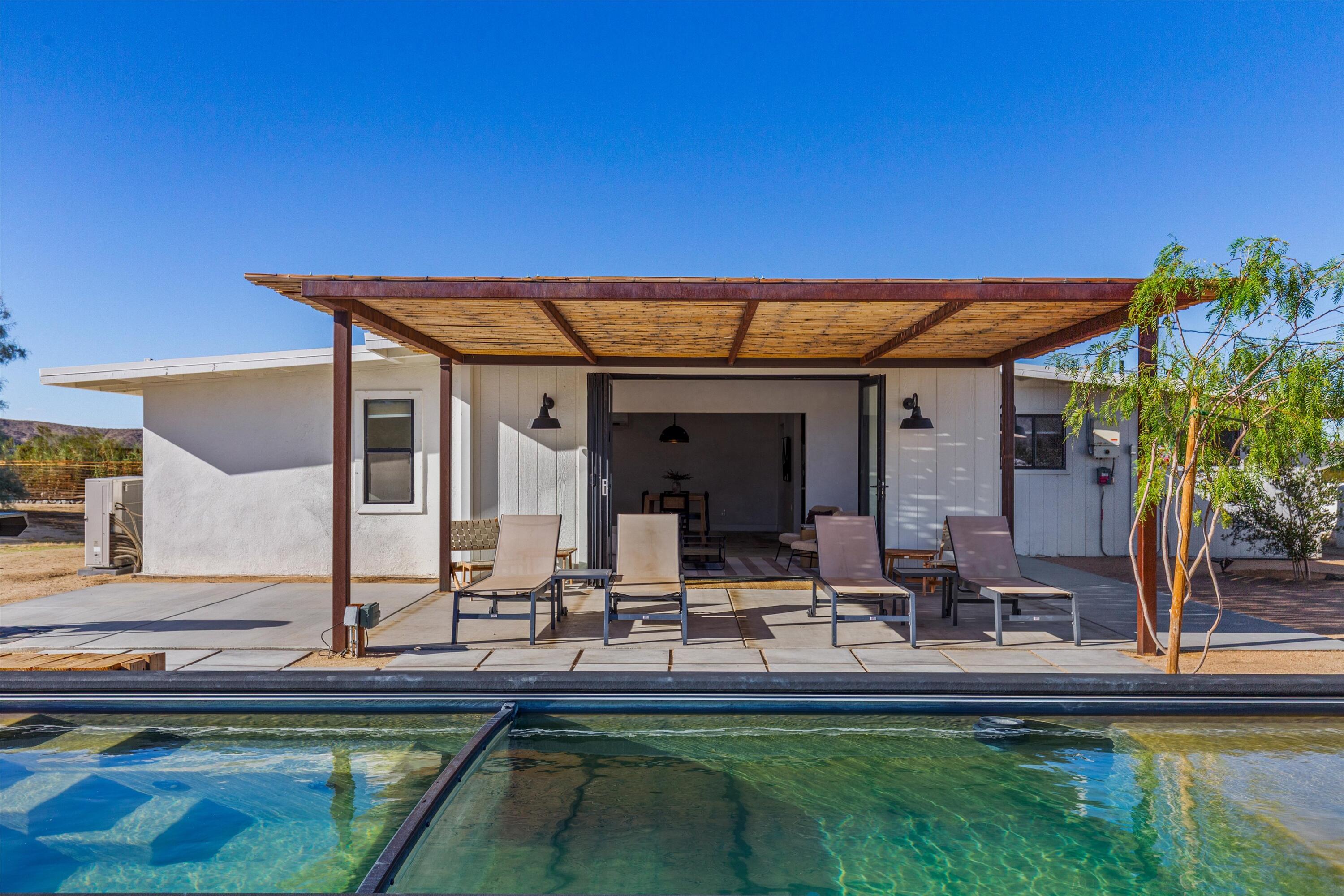 4610 Sunkist Road Joshua Tree, CA 92252 - Photo 32 of 55 a view of swimming pool with outdoor seating