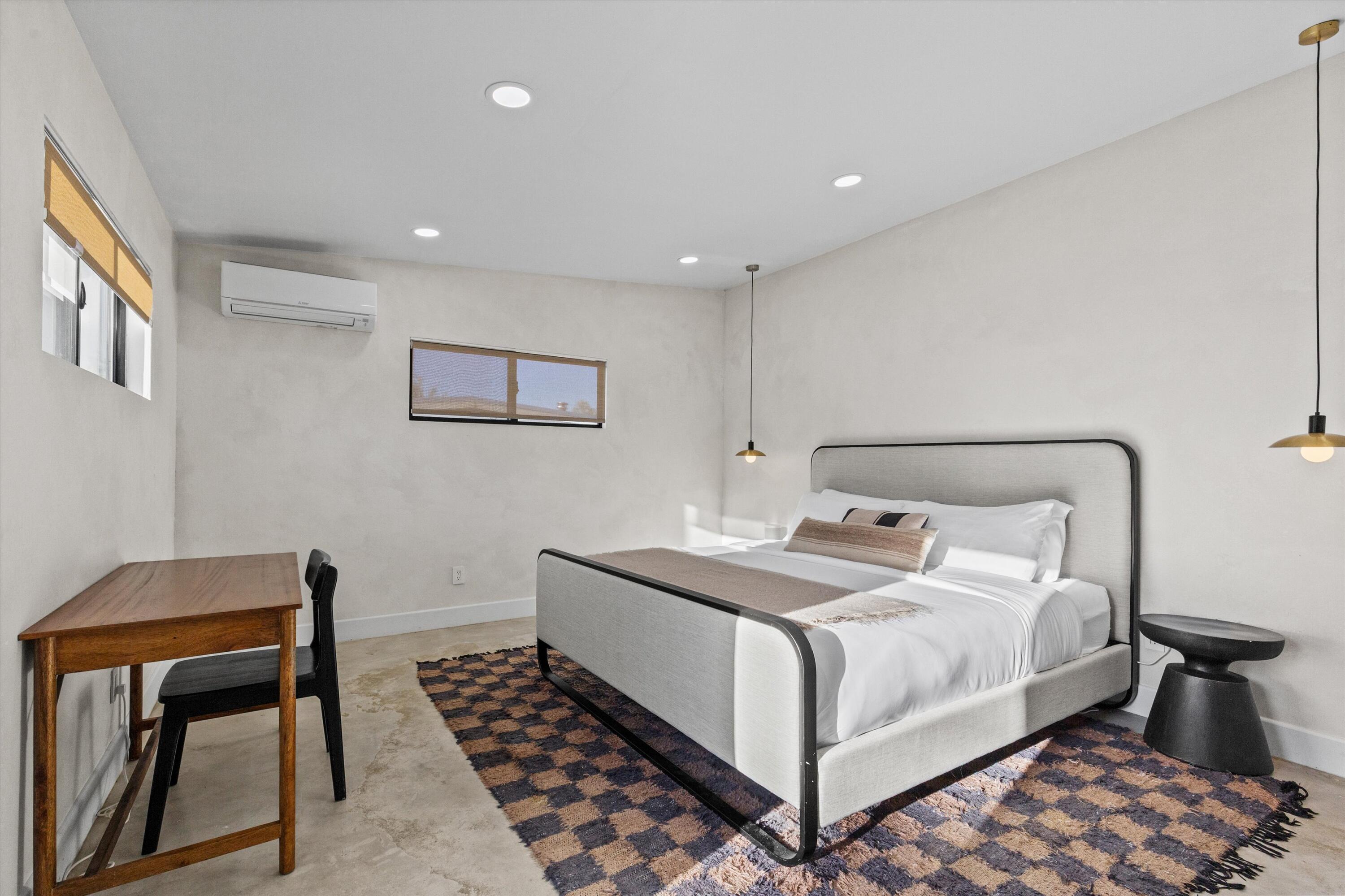 4610 Sunkist Road Joshua Tree, CA 92252 - Photo 40 of 55 a bedroom with a bed and a desk