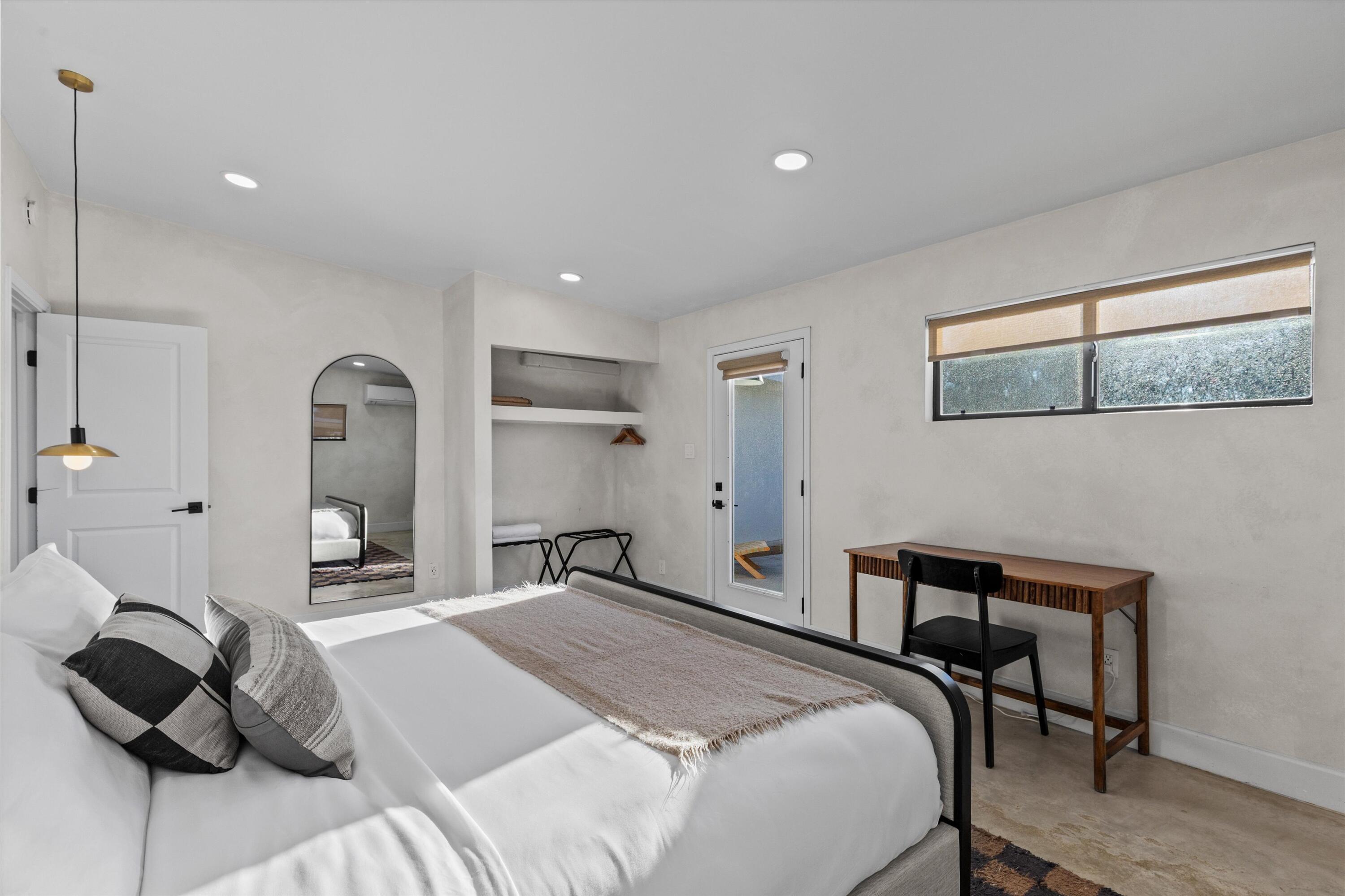 4610 Sunkist Road Joshua Tree, CA 92252 - Photo 41 of 55 a bedroom with a bed and a dresser