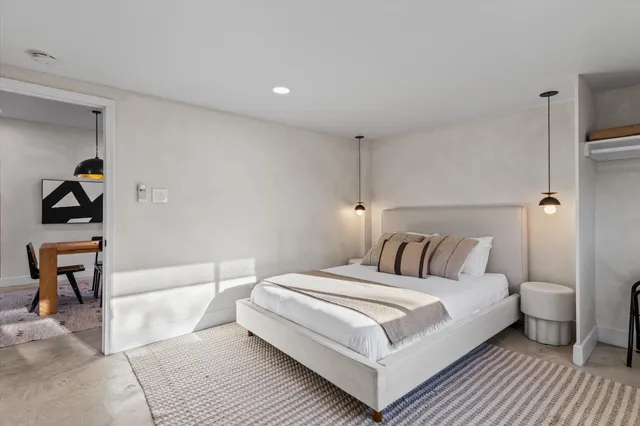 a view of a swimming pool with a yard and lake view