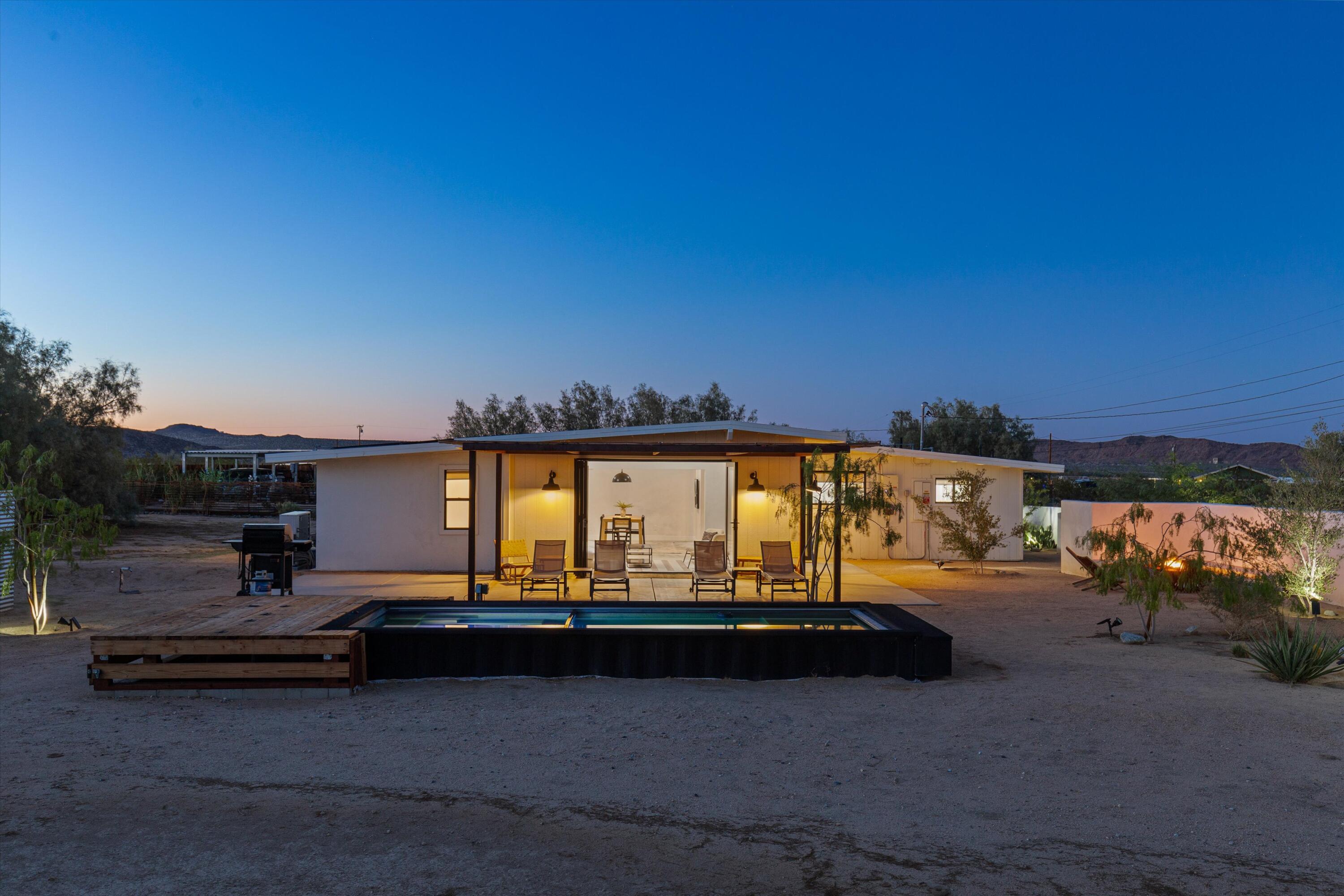 4610 Sunkist Road Joshua Tree, CA 92252 - Photo 47 of 55 a view of a terrace with a bench