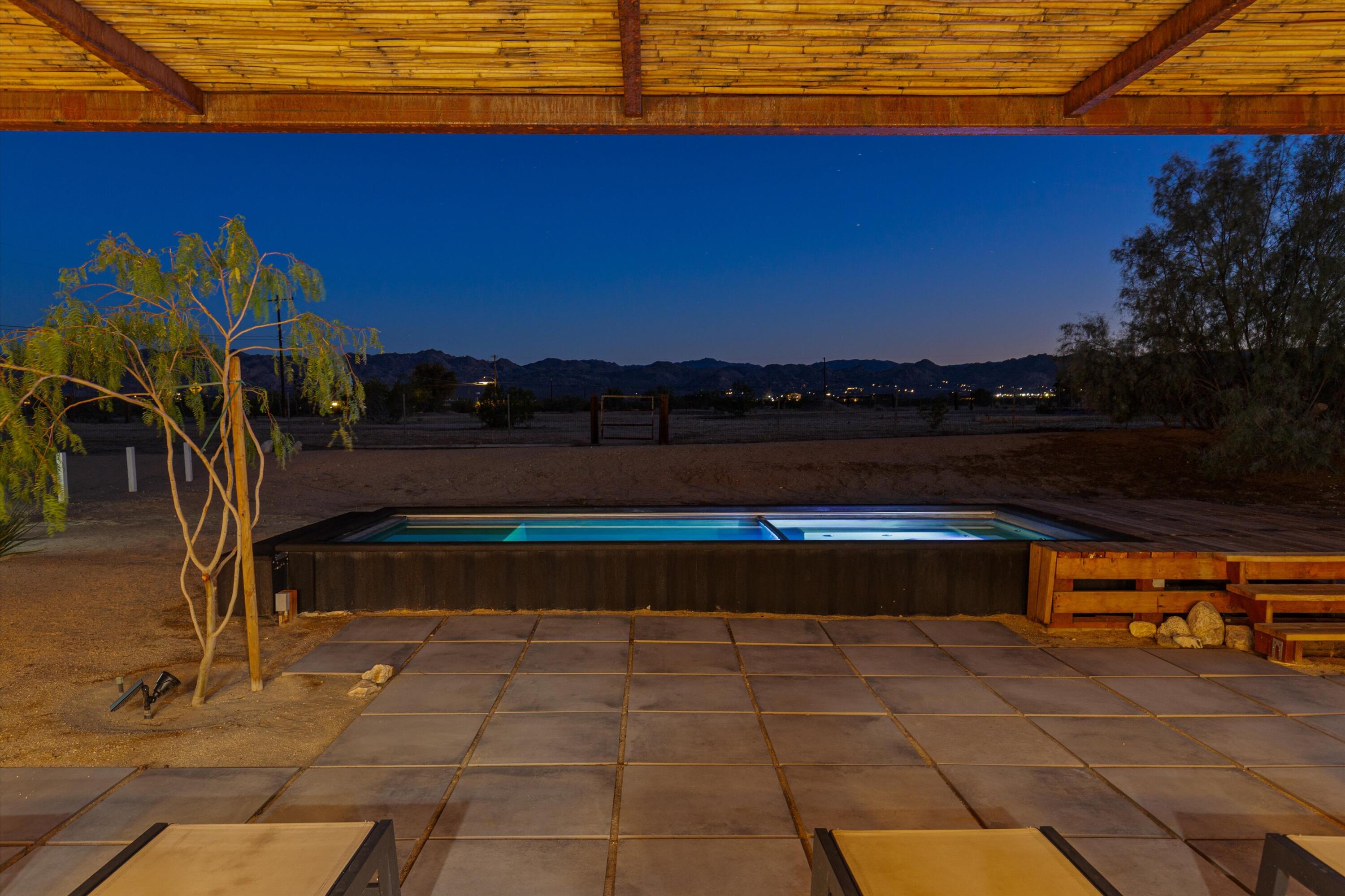 4610 Sunkist Road Joshua Tree, CA 92252 - Photo 49 of 55 a view of swimming pool with a table and chairs