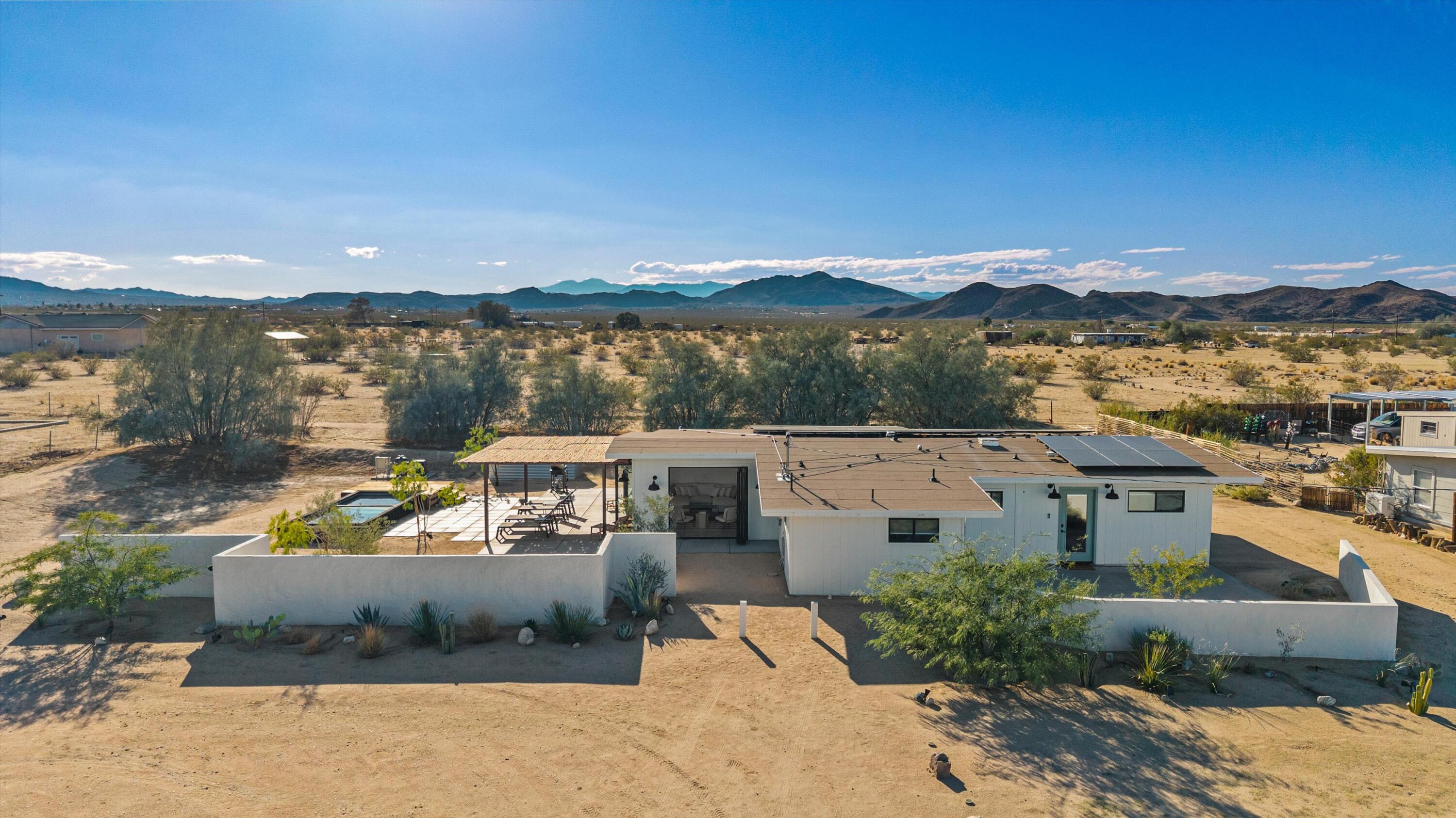 4610 Sunkist Road Joshua Tree, CA 92252 - Photo 7 of 55 a view of a terrace with couches and city view